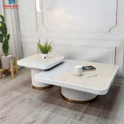 Bàn trà couple mặt trắng bo góc chân tròn đặt cạnh sofa, phù hợp tham khảo trước khi chọn mua