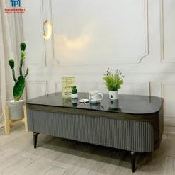 Bàn sofa đá đen thân xám bo tròn phải đặt cạnh sofa, phù hợp tham khảo trước khi chọn mua