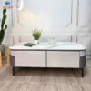 Bàn sofa đá trắng hồng nhạt chân cao đặt cạnh sofa, phù hợp tham khảo trước khi chọn mua tại Đà Nẵng