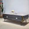Bàn sofa đá xám xanh thân đen viền vàng đặt cạnh sofa, phù hợp tham khảo trước khi chọn mua