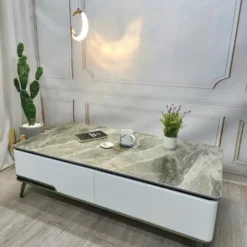 Bàn sofa mặt đá xám một ngăn kéo chân cao trong phối cảnh phòng khách hiện đại