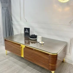 Thiết kế Bàn trà mặt gương nâu vân gỗ chân vàng nhìn trực diện, dễ so sánh với các mẫu cùng nhóm