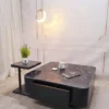 Bàn trà vuông đá nâu kèm bàn phụ đen đặt cạnh sofa, phù hợp tham khảo trước khi chọn mua