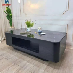 Góc chụp thực tế Bàn sofa xám đậm hộc trơn bo tròn với màu sắc và kiểu chân rõ nét